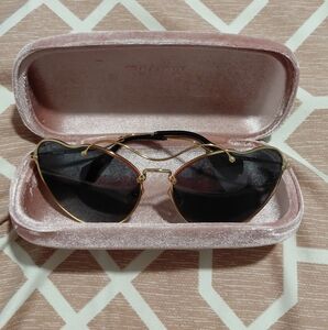 Miu Miu Gold Frame Sunglasses with Black Lenses